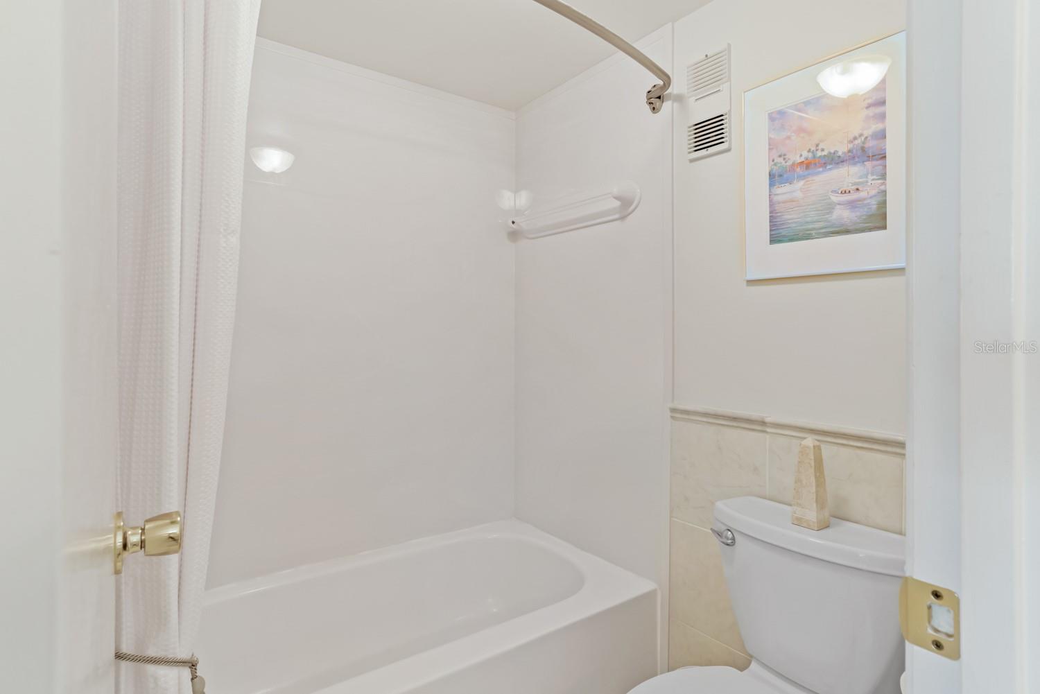 Master bathroom with tub and shower