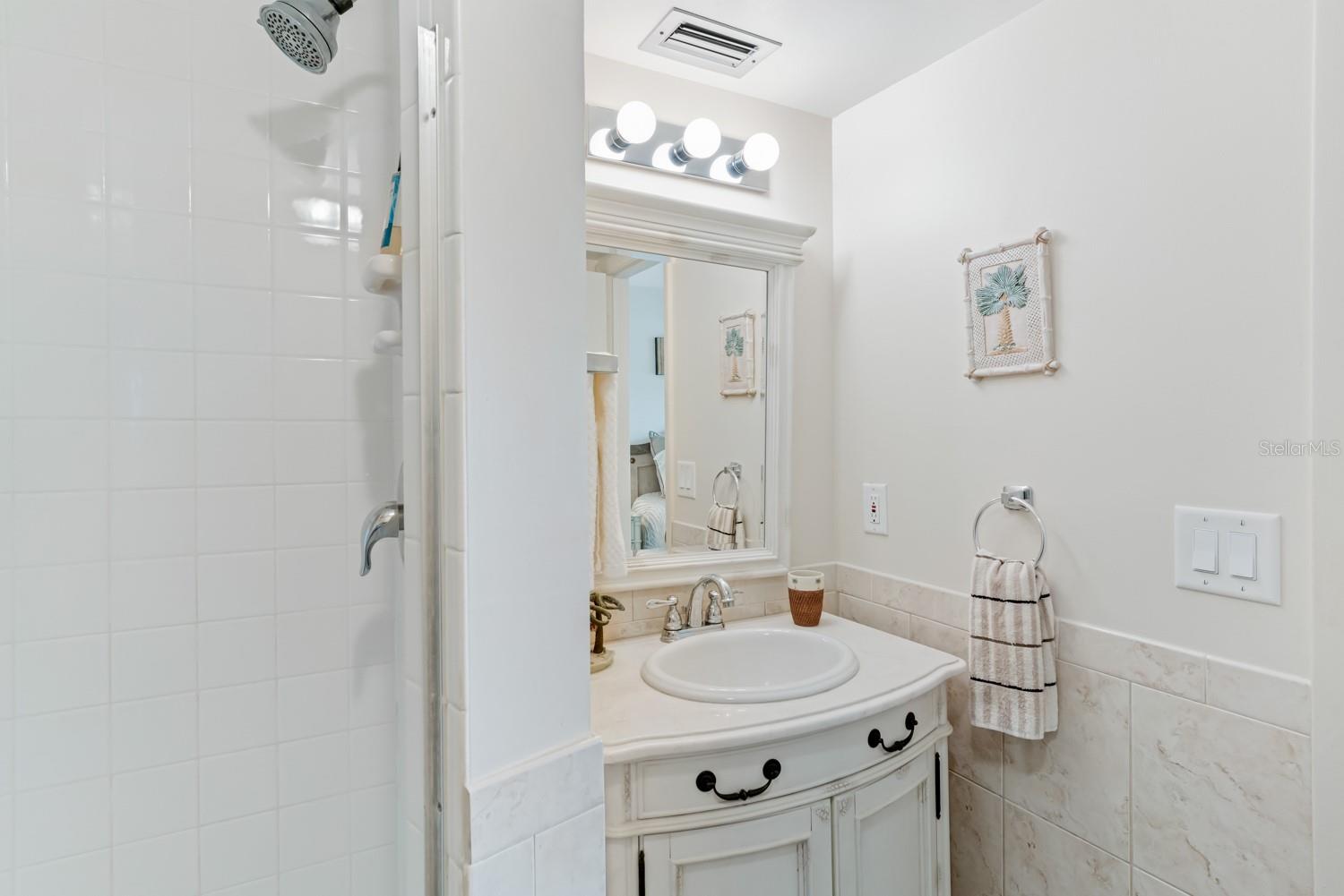 Bathroom with shower and vanity