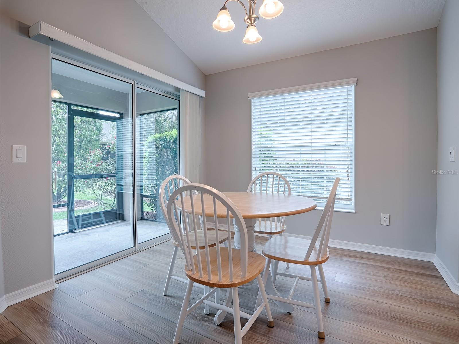 CASUAL DINING AREA OFF THE KITCHEN WITH SLIDING GLASS DOOR TO THE LANAI.