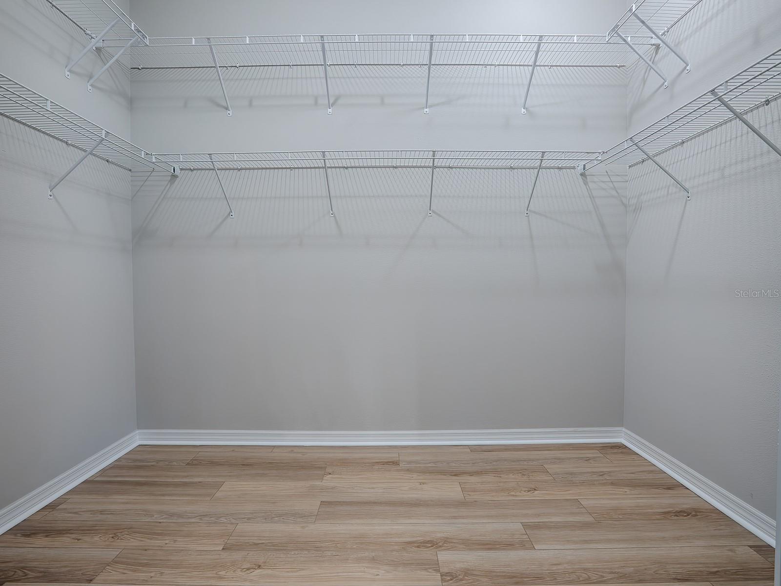 WALK-IN MASTER BEDROOM CLOSET. EXTRA SHELVING!