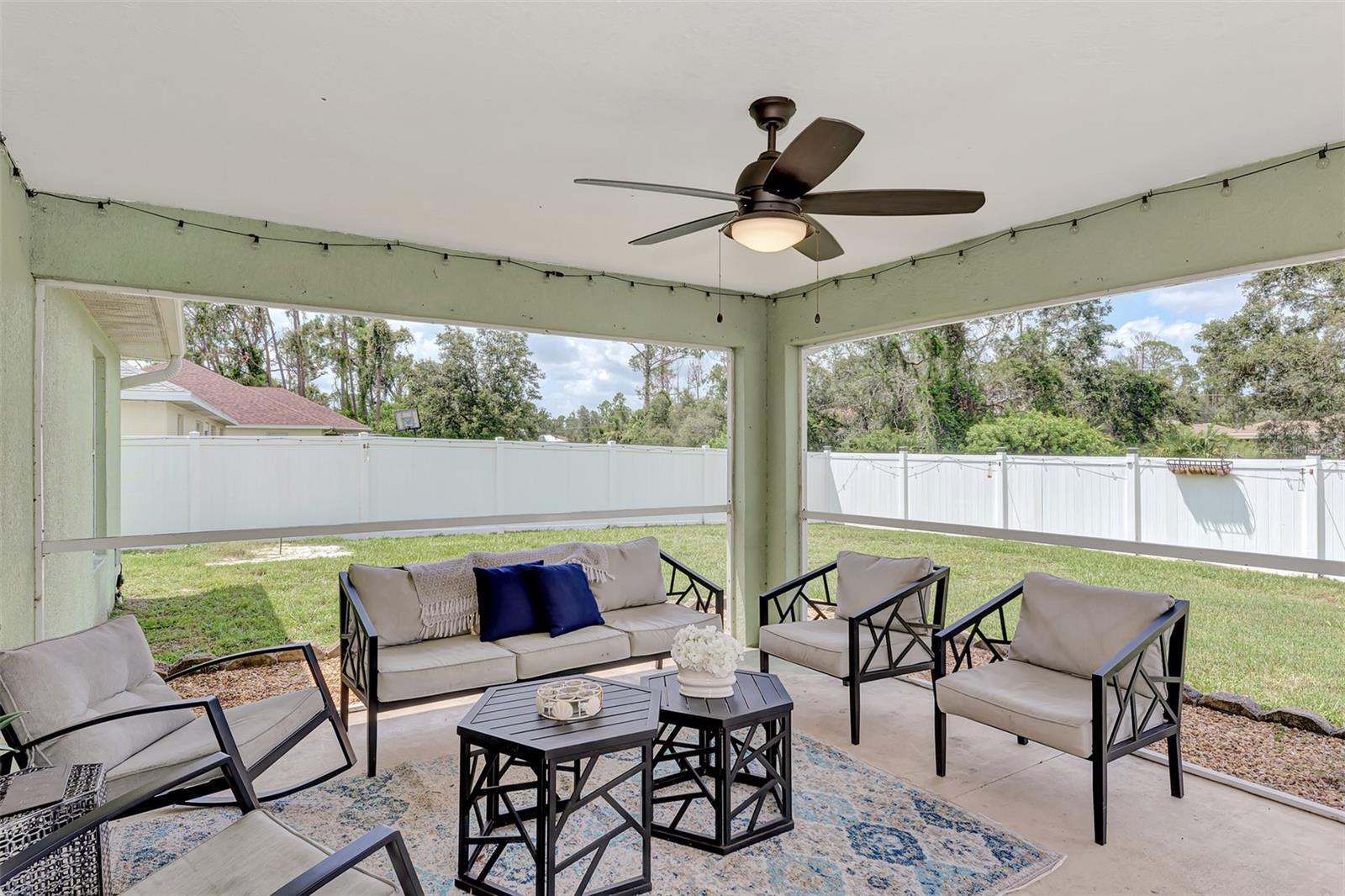 Screened in back Patio with privacy fence