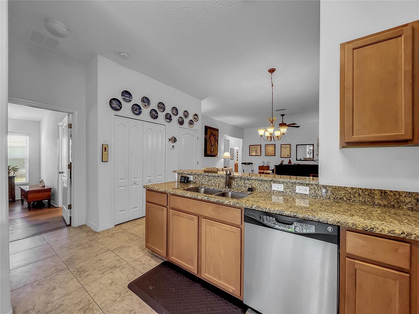 A large pantry with abundant storage is next to the kitchen