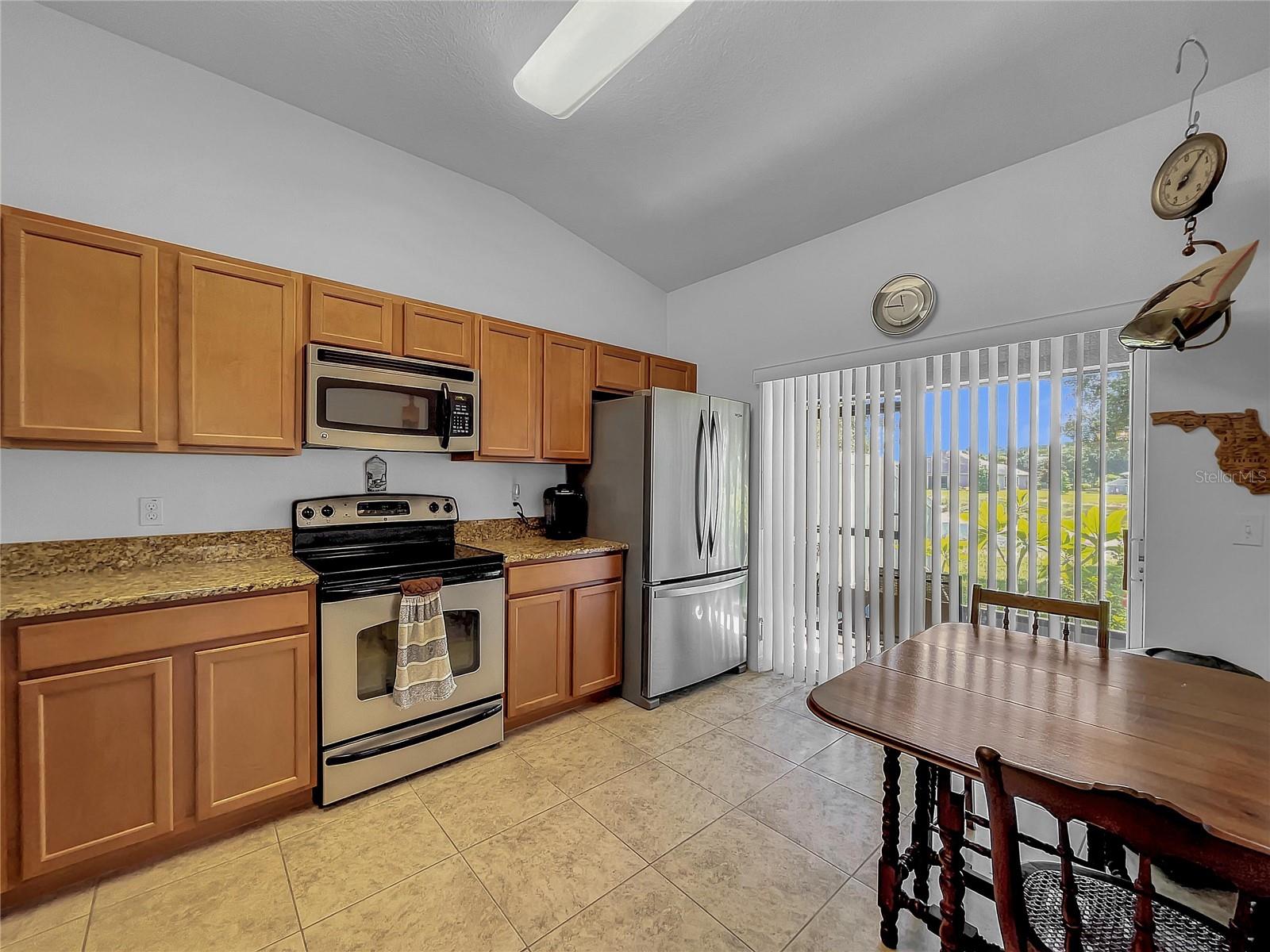 Sliding glass door goes to screened lanai