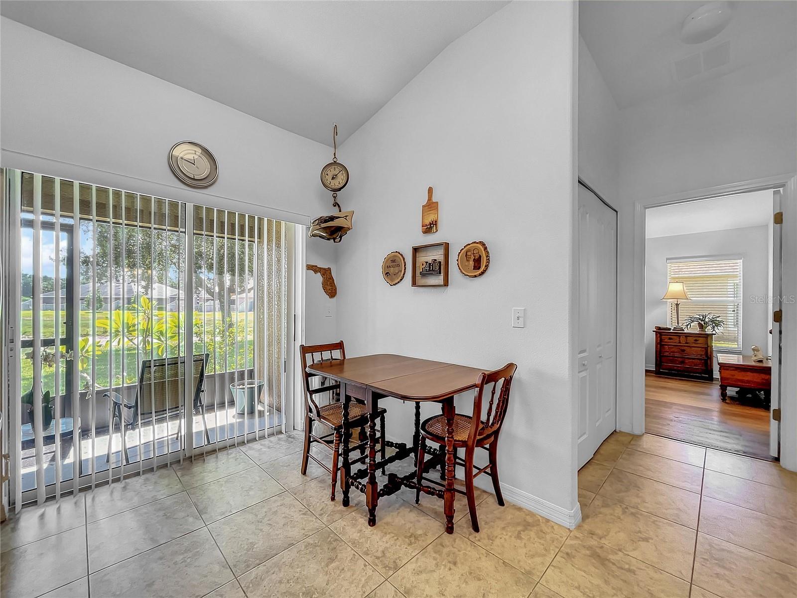 Kitchen table with laundry area between kitchen and master bedroom