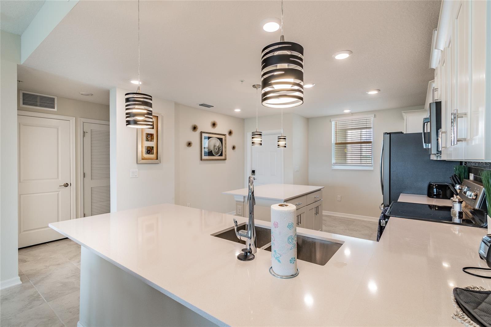 Impeccably decorated and furnished, Quartz countertops, stainless steel appliances