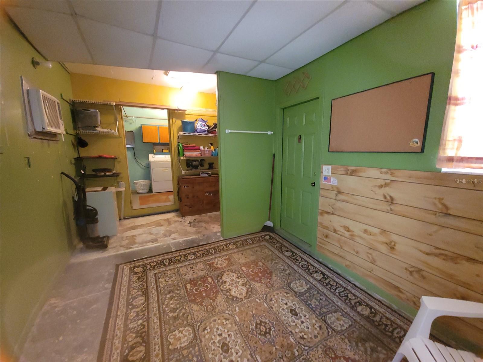 Bonus Rm. Converted Garage. Wall unit A/C. The door is located left of the front door.