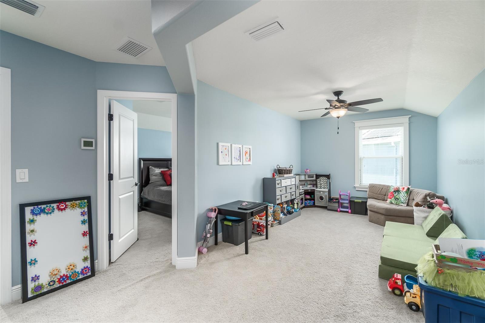 upstairs loft with bedroom and full bathroom