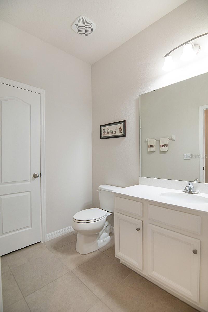 1/2 bath downstairs next to bedroom 5. Closet along wall should be enough room to add tub/shower per builder option plans