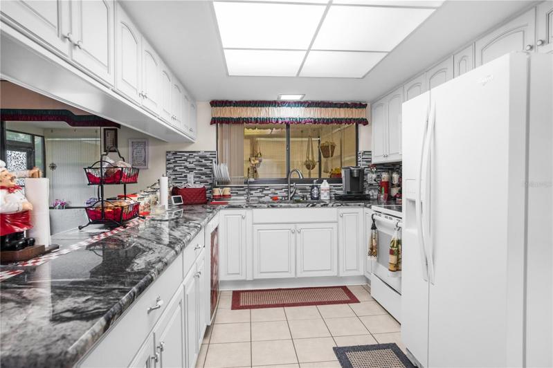 Amazing Remodeled  Kitchen with Beautiful White Cabinets and an Abundance of Countertop Space