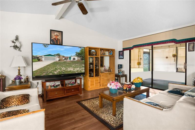 The Family Room has Sliding Glass Doors leading out to the Enclosed Porch