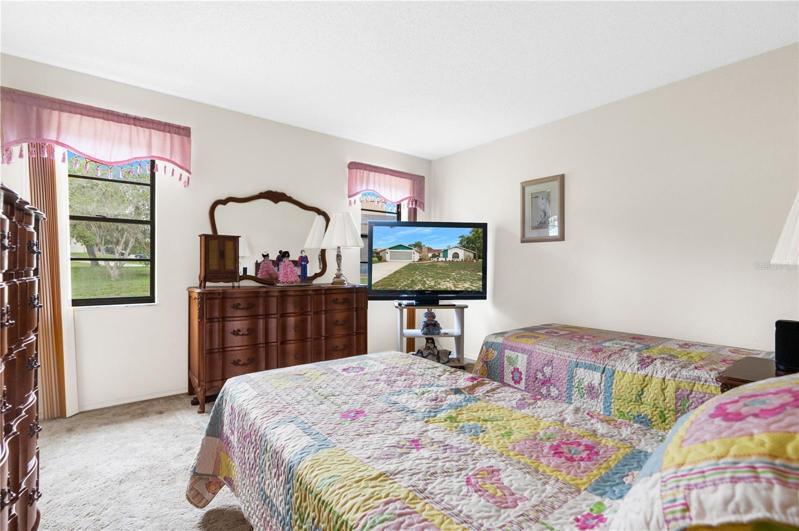 Bedroom 2 has multiple widows that provide amazing light shining through