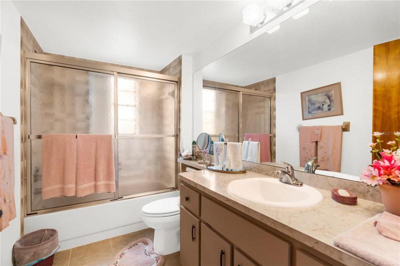 The Guest Bathroom features a Tub/Shower combo, Lots of Cabinet storage and tons of countertop space