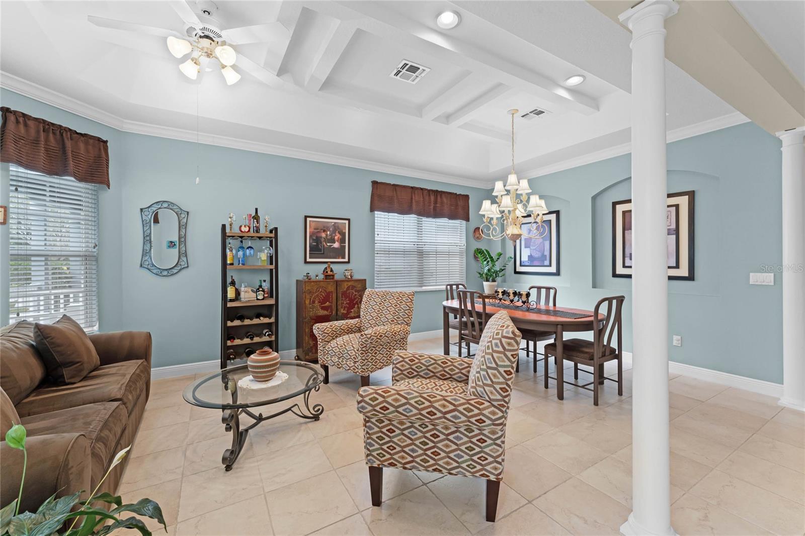 The Great room features a high and coffered ceiling.