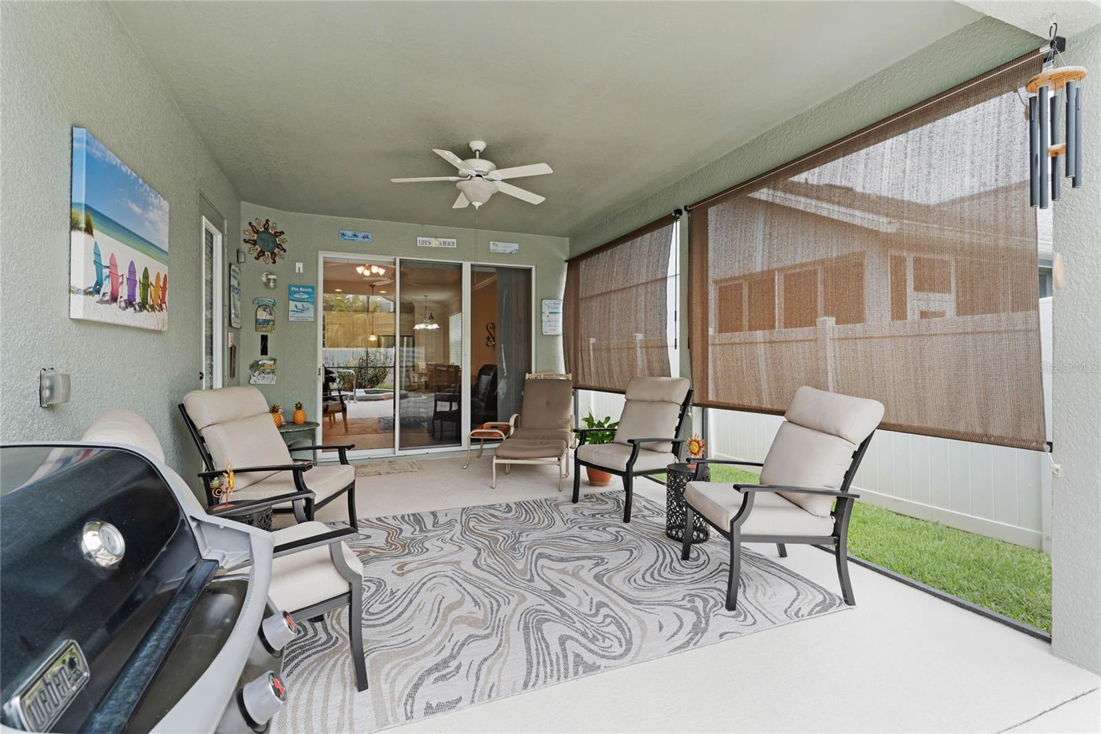 Step outside to the outdoor oasis, where you'll find a good-sized lanai with roll-down shades for added comfort.