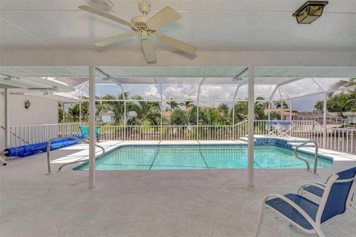 Covered Lanai overlooking the heated Pool and Canal