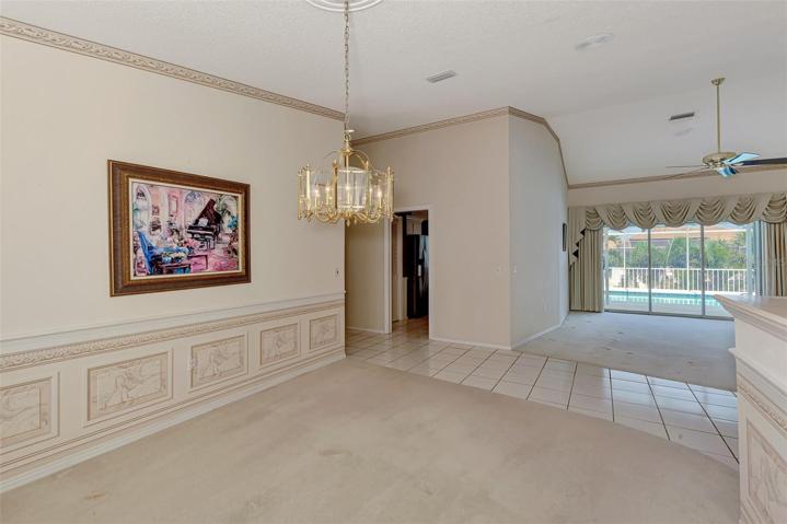 View from dining room to Living Room with door to the kitchen