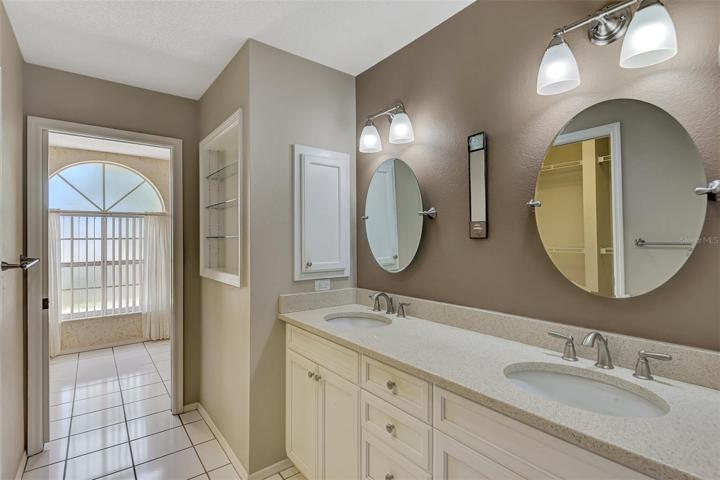 Master bath with dual vanities. Garden and separate Shower