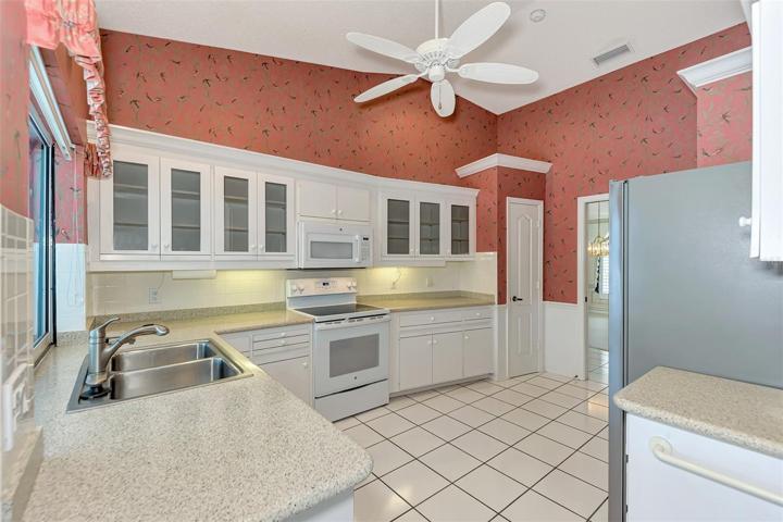 Kitchen with pocket slider (pass Through) to Pool area