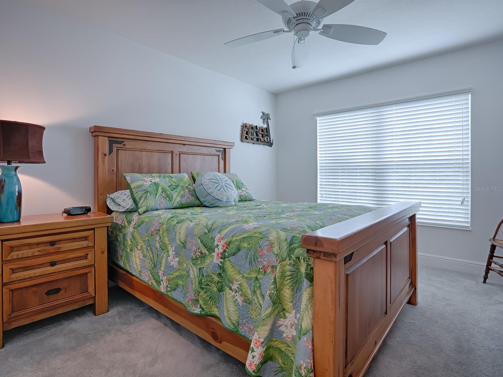 THROUGH A POCKET DOOR OFF THE FOYER IS THE FRONT GUEST BEDROOM WITH CARPET!