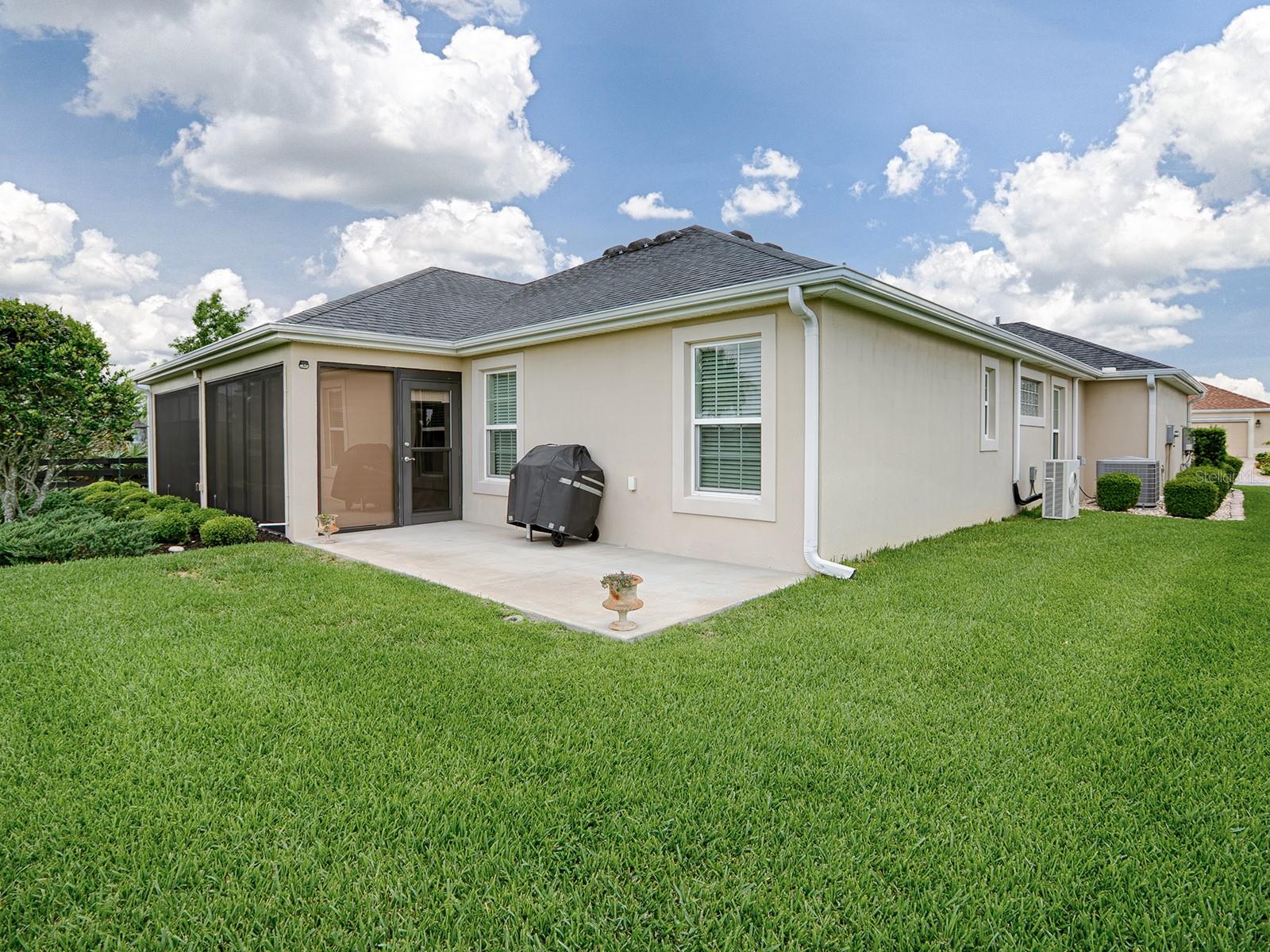 FROM YOUR LANAI STEP OUT TO YOUR PATIO ... GREAT SPOT FOR THE GRILL. GUTTERS AROUND THE ENTIRE HOME!