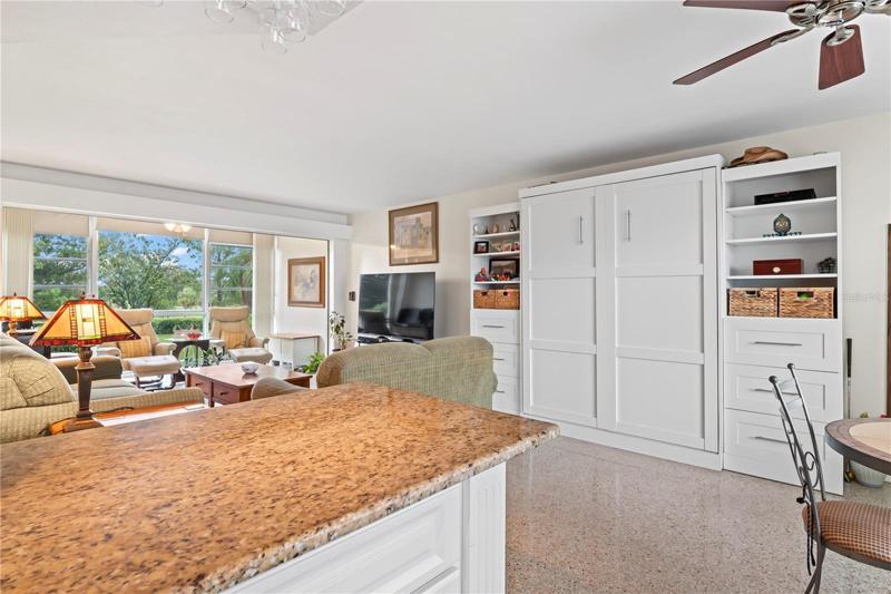 Kitchen has open concept to living room/dining room