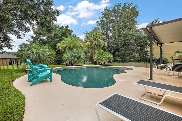Dine al fresco or be amazed by a dazzling sunset under the covered patio with an insulated roof is 10'-6" x 20' ~