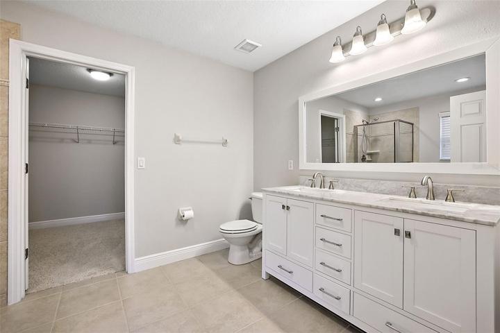 Ensuite master bath has a walk in closet 11'-9" x 7'-6" big enough to share, upgraded raised dual vanity ~