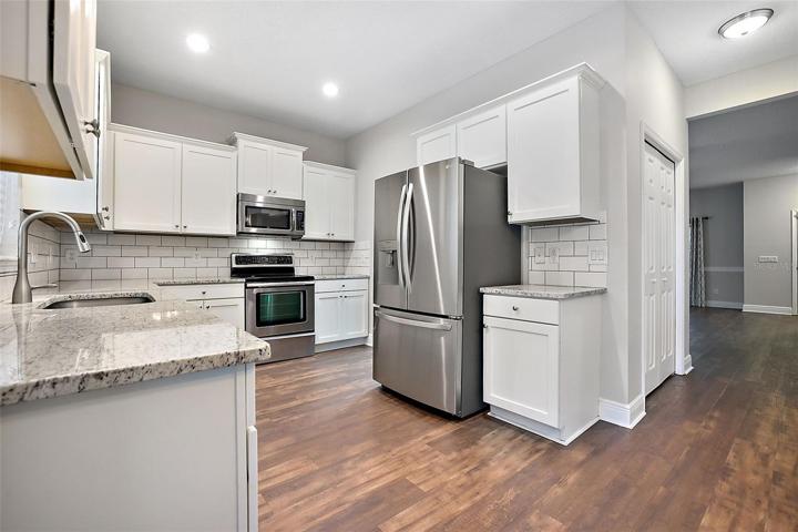 Convenient storage closet to left of this gorgeous kitchen ~