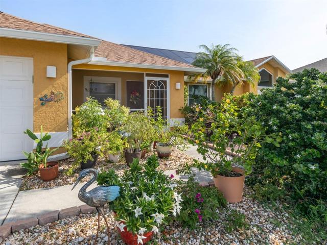 Tropical Flowers greet you at the entrance of the home.