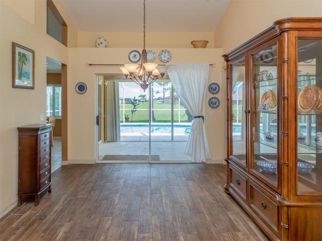 Great room dining space has access out to the lanai and pool.