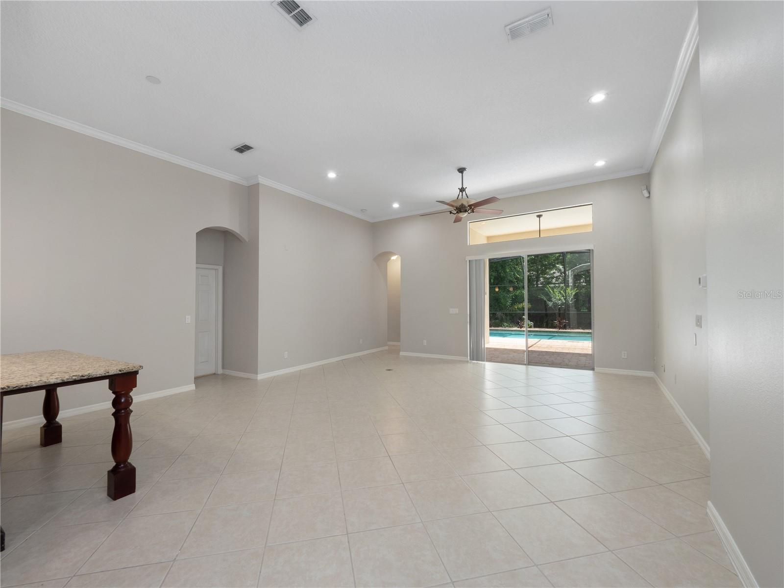 Large family room/ kitchen combo with views to pool