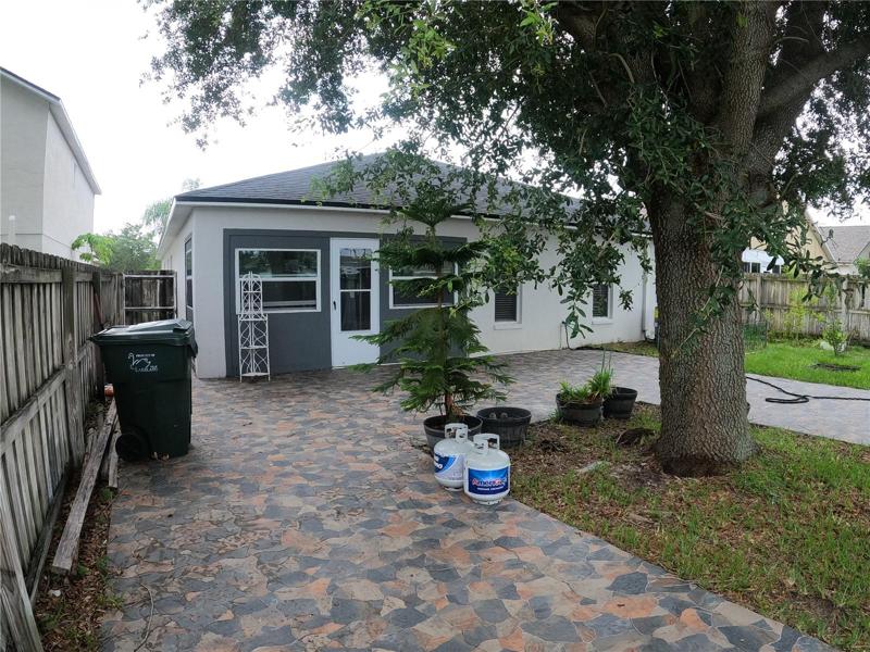 Rear of home with tile