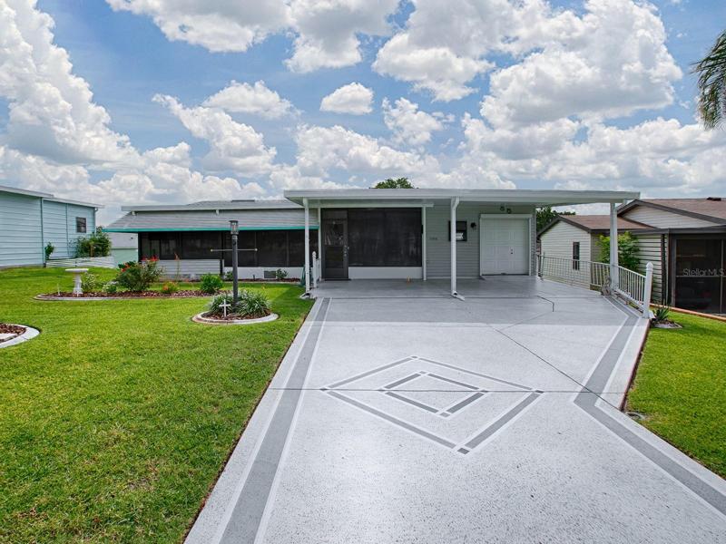 UPDATED 2/2 with GOLF CART GARAGE and 2 Car Carport located in Orange Blossom Gardens