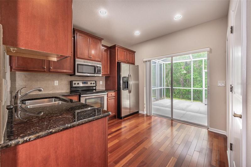 Granite counter and stainless steel appliances plus a closet pantry and all kitchen appliances are included. There is room for a kitchen table if you choose to put one.
