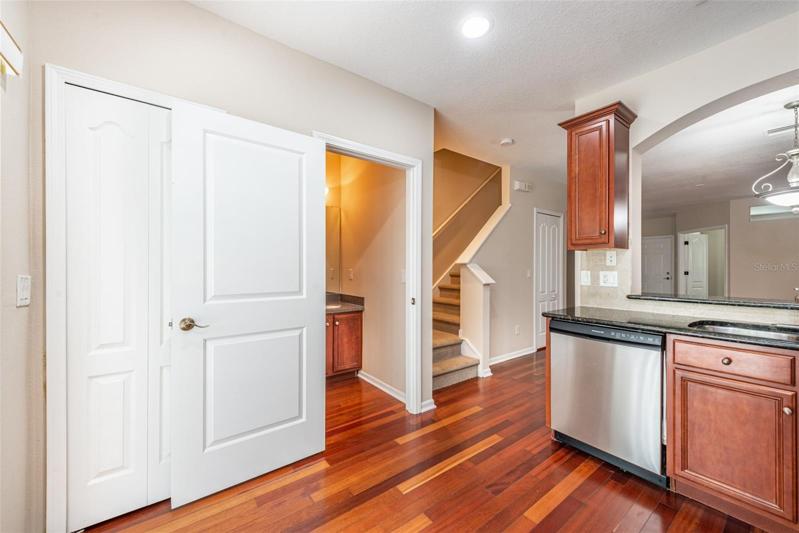 The half bath is next to the kitchen.