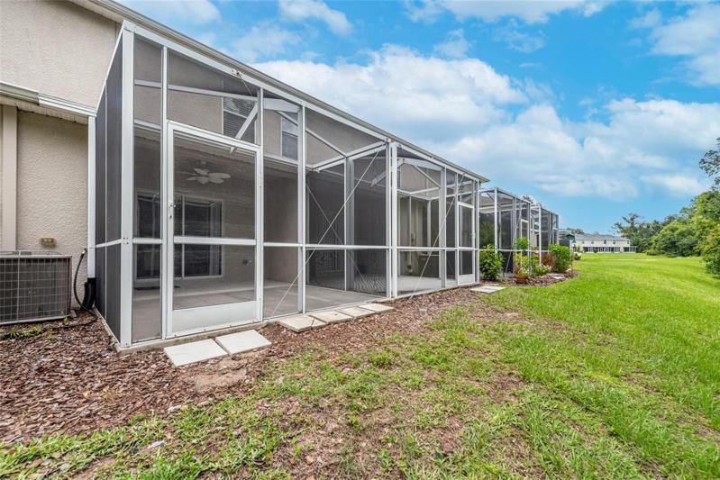 Extended screened porch with no backyard neighbors.
