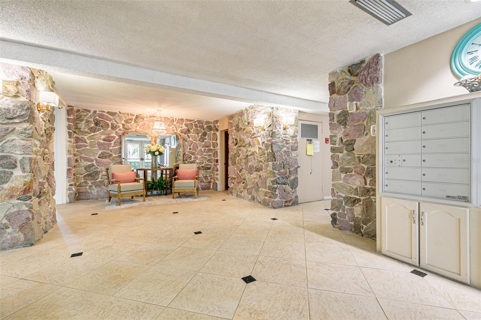 Front lobby with sitting area and access to elevators.