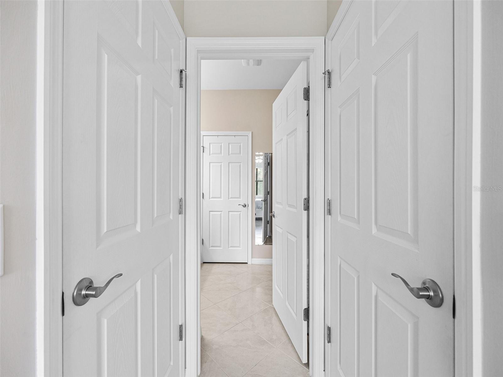 Two walk in closets in the hallway to the ensuite bathroom