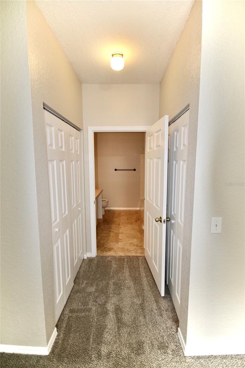 Primary Closets/Door to Bath