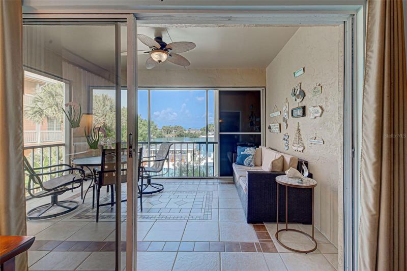 SCREENED LANAI OFF THE LIVING ROOM WITH VIEWS OF THE INTRACOSTAL WATERWAY