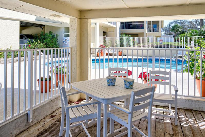 COVERED AREA TO DINE WATERSIDE OR ENJOY A COOL DRINK POOL SIDE