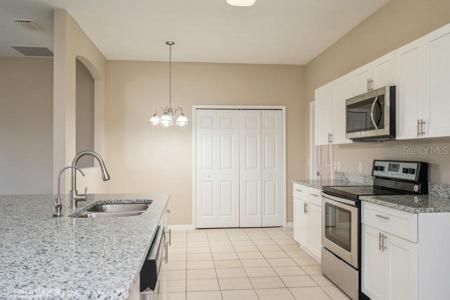KITCHEN LOOKING TOWARDS EAT IN NOOK