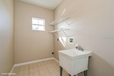 LAUNDRY ROOM OFF OF KITCHEN WITH ACCESS TO GARAGE