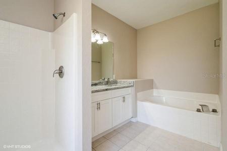 ENSUITE TO PRIMARY, SOAKING TUB, DUAL SINKS STEP IN SHOWER