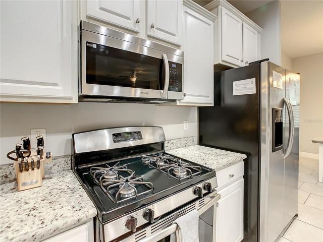 Kitchen with SS appliances and granite counter tops