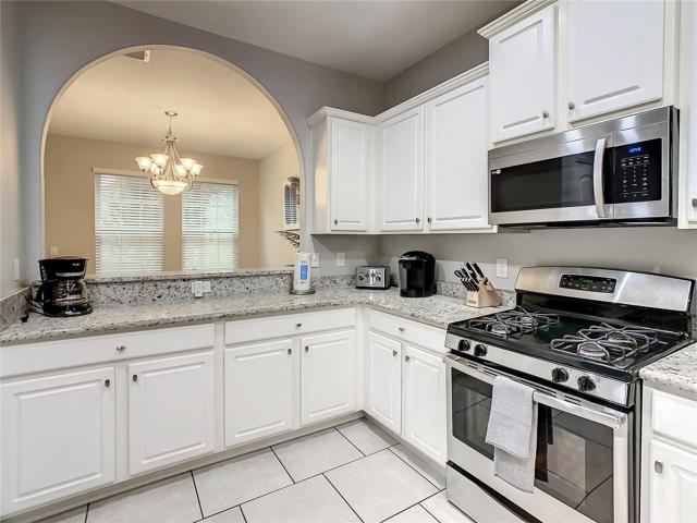 Kitchen with SS appliances and granite counter tops