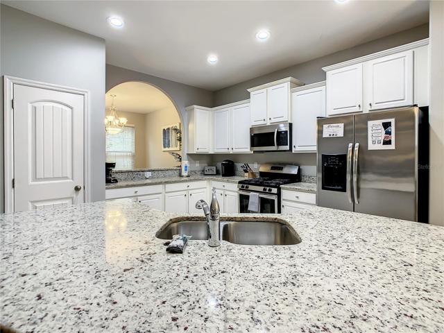 Kitchen with SS appliances and granite counter tops