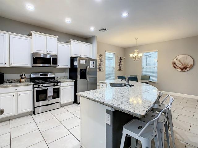 Kitchen with SS appliances and granite counter tops