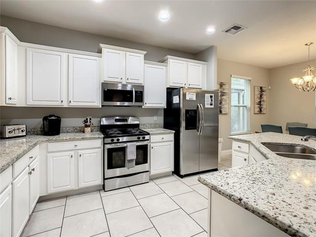 Kitchen with SS appliances and granite counter tops