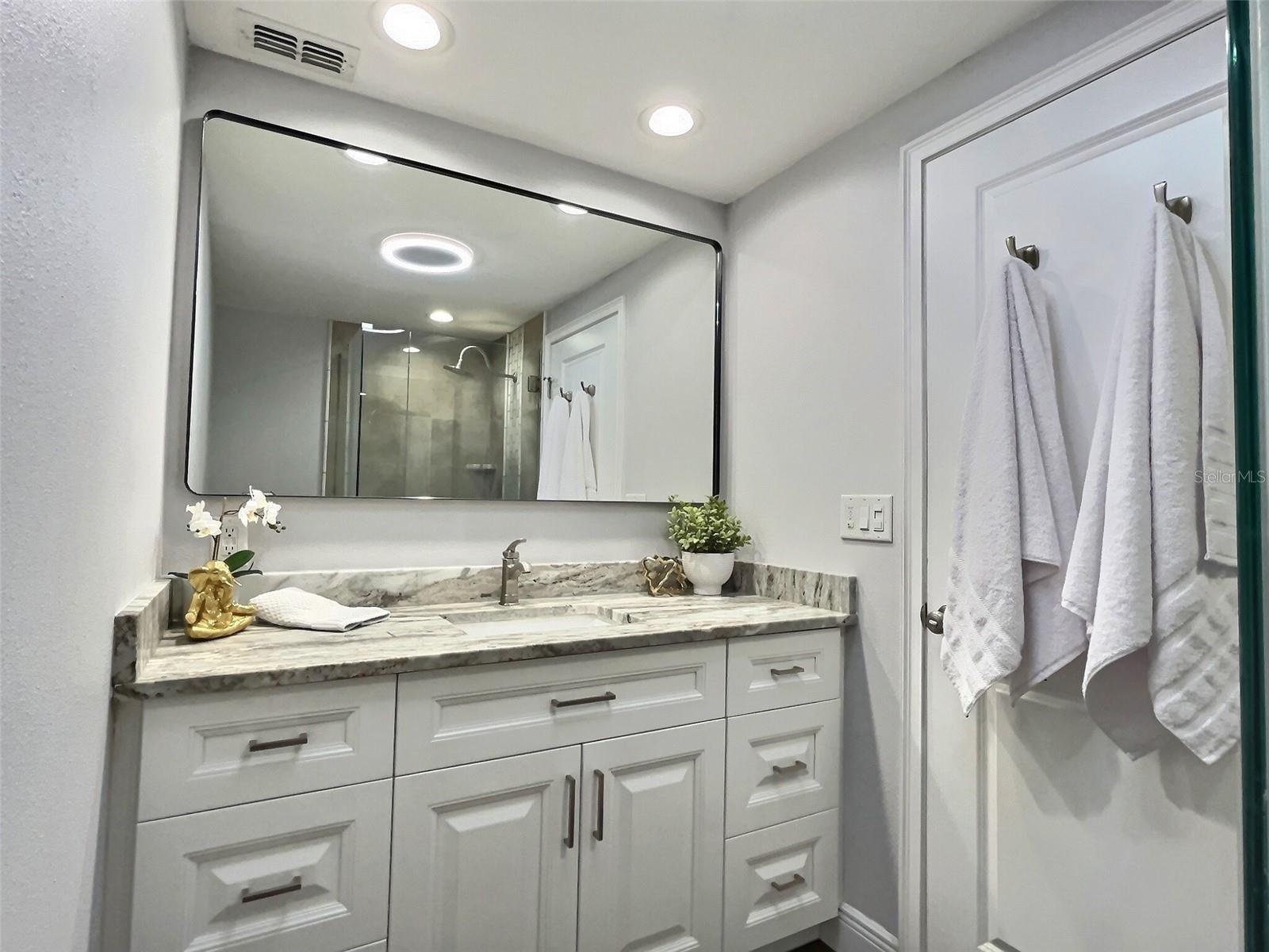 Lovely Primary Bathroom with leathered granite.